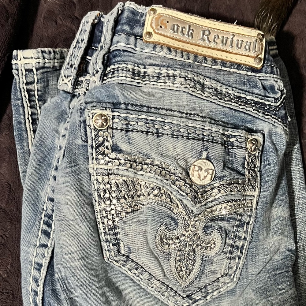 Rock Revival Faded Blue Jeans with Silver Accents